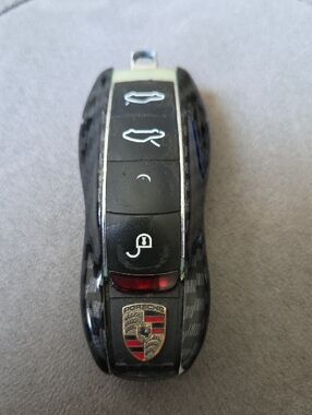 Porsche Smart Key Fob With A Carbon Fiber Shell Replacement Cover.